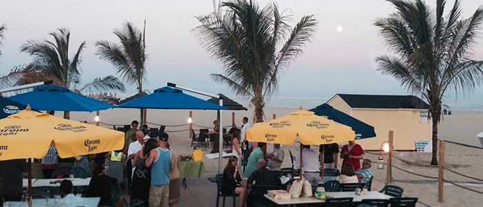 People hanging outside at Jenkinson's Inlet Bar and Restaurant.