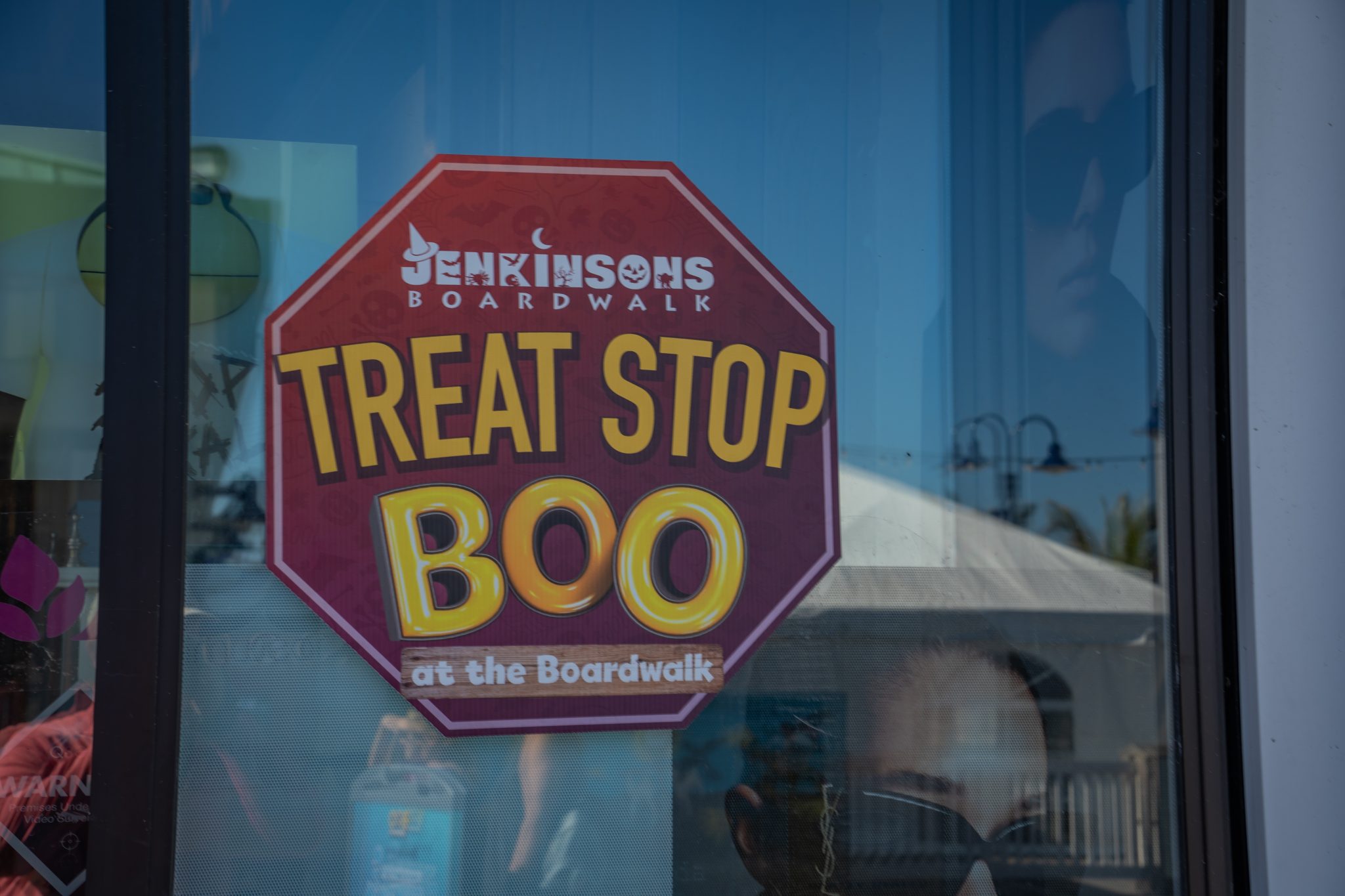 a stop sign that says Treat Stop for Boo at the Boardwalk at Jenkinson's Boardwalk