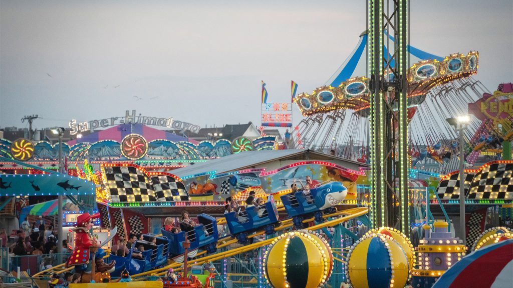 A photo of the Shark Escape ride in the amusement park at Jenkinson's Boardwalk in Point Pleasant Beach, NJ on a busy summer night.