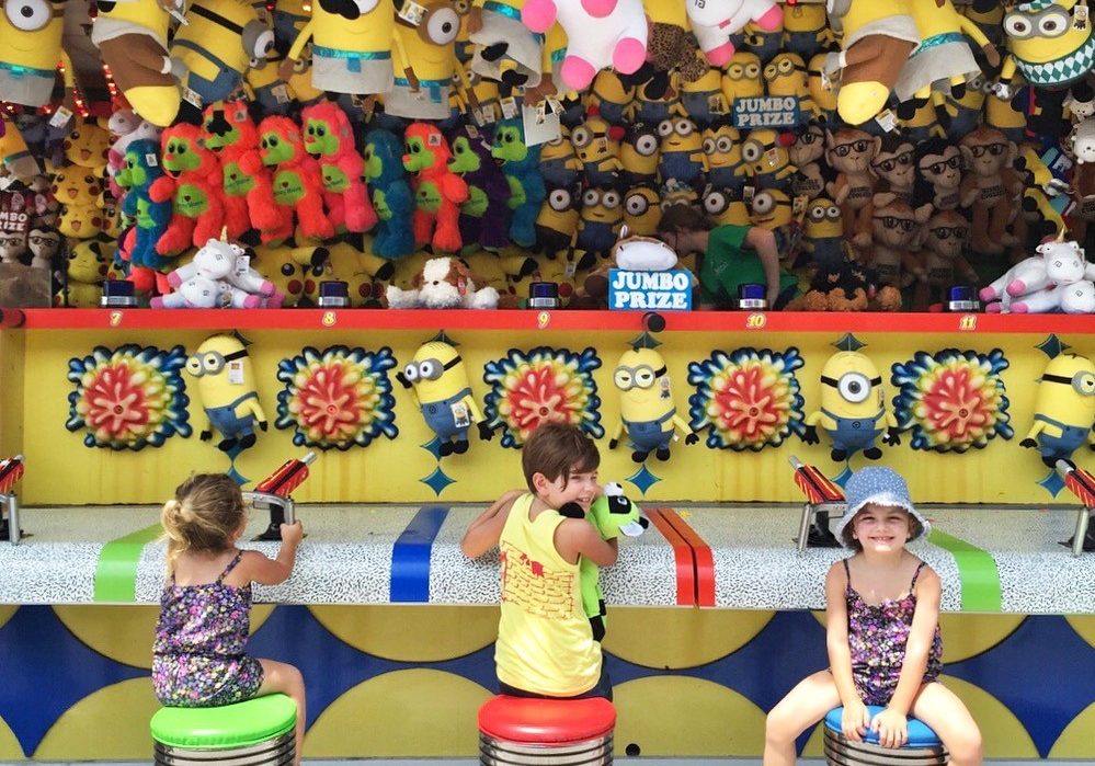 Children having fun playing the water gun game on Jenkinson's Boardwalk.