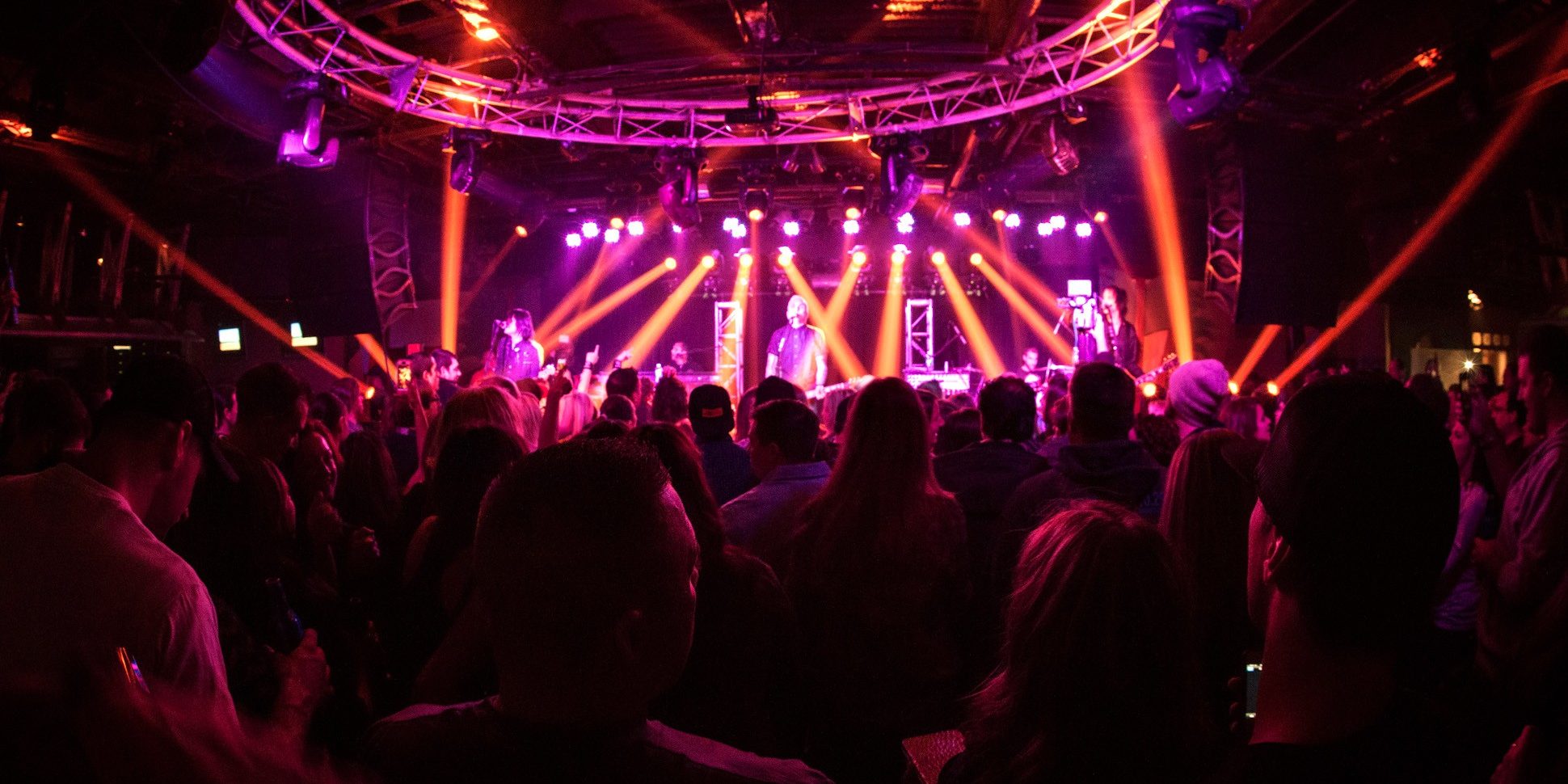 A music performance on the Jenk's Club stage with people in the crowd.